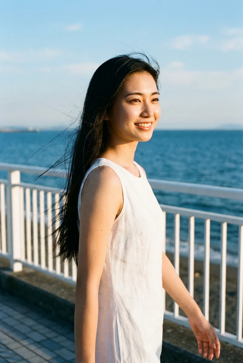 Nano Banana Proの作例（4枚目）：キーワードを並べた：beautiful Japanese woman, 20 years old, … seaside promenade, white railing …